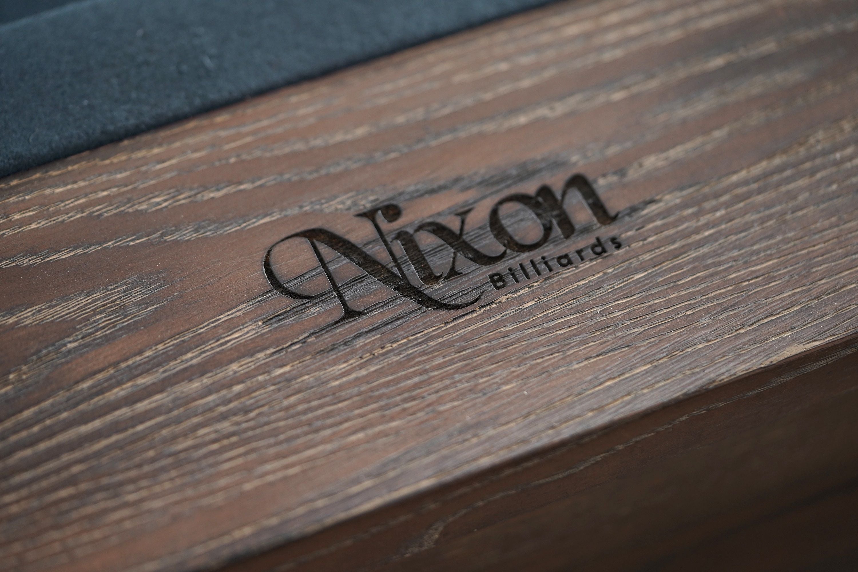 Nixon Billiards Hunter Slate Pool Table Brushed Walnut Wood Leg Close Company Logo